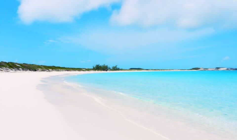 beaches-and-relaxation | Hideaways Beach Resort Exuma, GeorgeTown Vacation Rentals Bright tropical beach with white sand, turquoise water, and a blue sky with a few clouds along the shoreline.